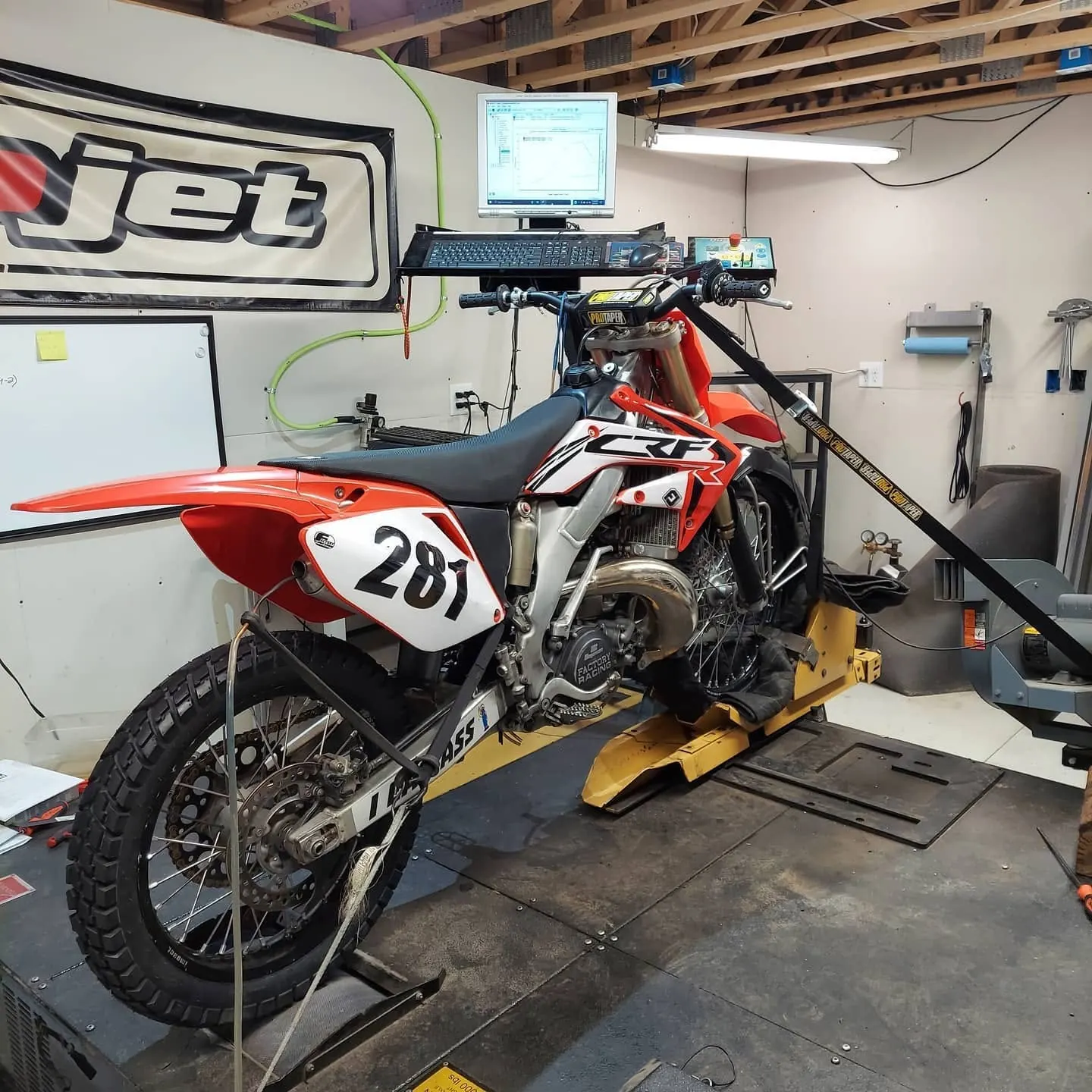 Dirt bike #281 strapped down on the Dynojet dyno