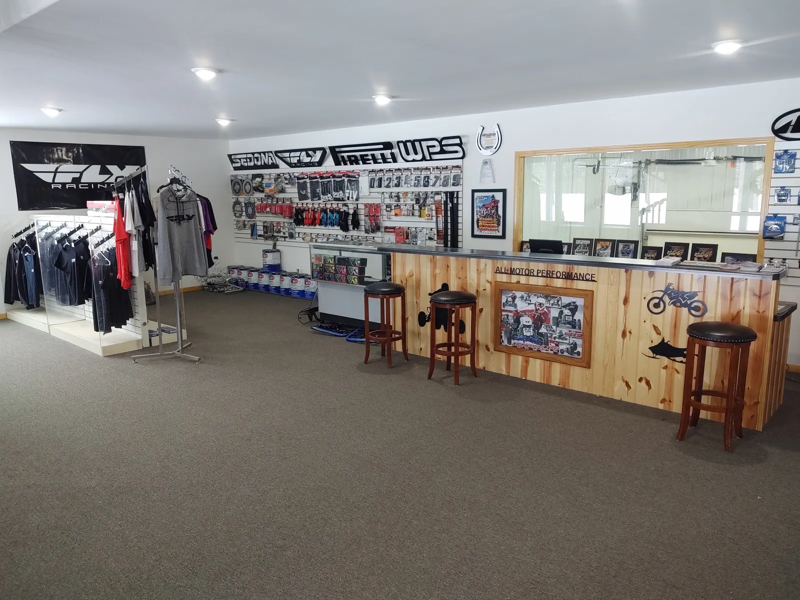 Riding apparel racks, parts counter and stools